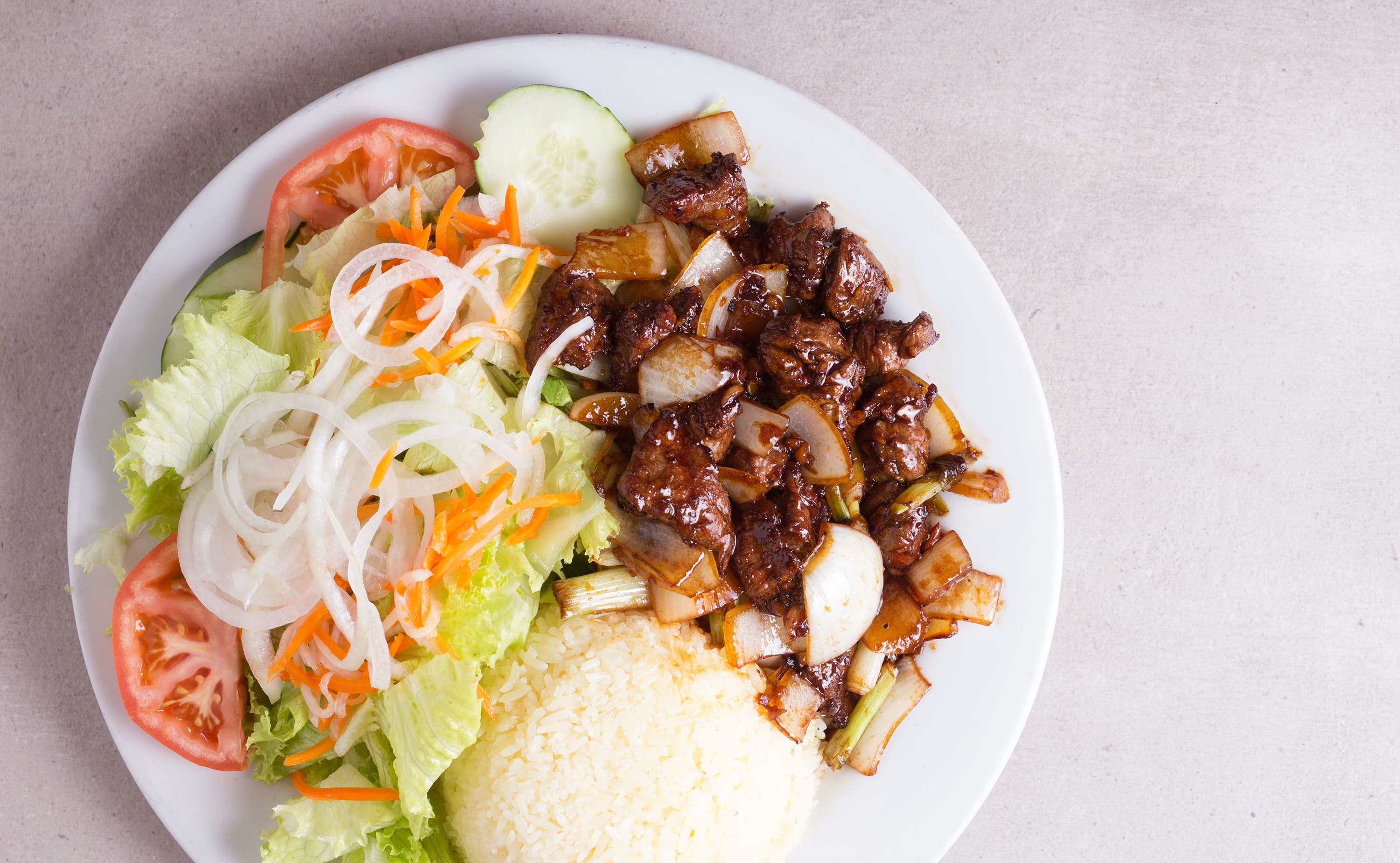 Diced garlic shaken beef with buttered rice