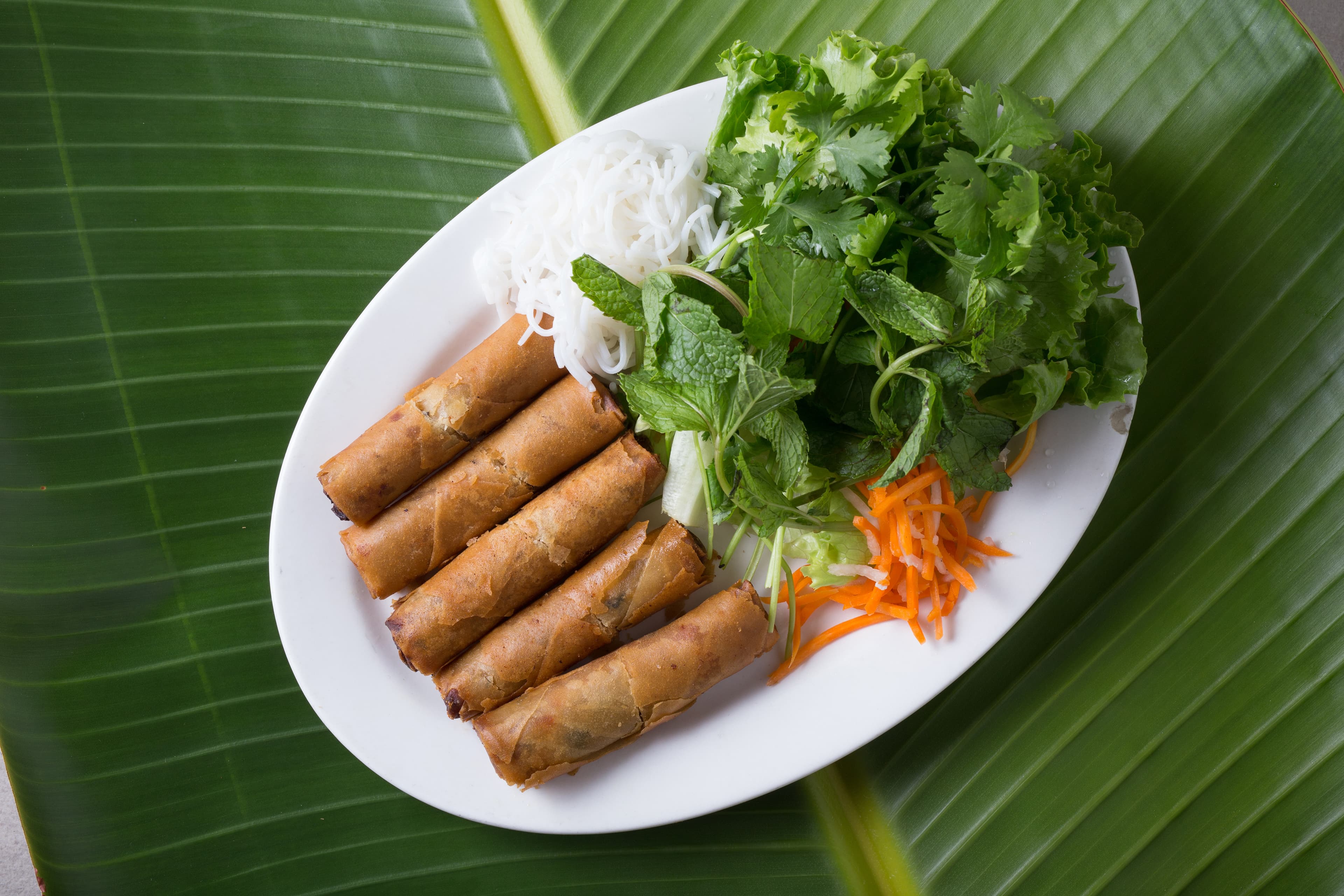 Charbroiled protein with fresh herbs at Pho Tasty
